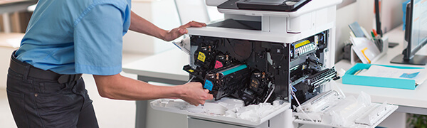 printer technician servicing printer
