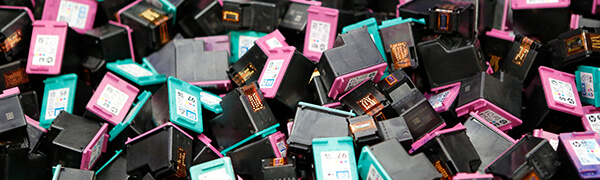 pile of cyan and magenta ink cartridges