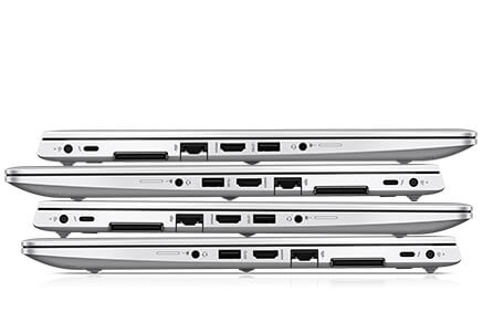 stack of four HP laptops